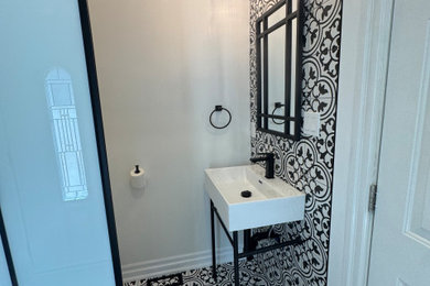 Inspiration for a mediterranean powder room remodel in Toronto
