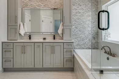 Inspiration for a mid-sized modern master gray tile ceramic tile, multicolored floor, double-sink and vaulted ceiling bathroom remodel in Dallas with shaker cabinets, gray cabinets, gray walls, an undermount sink, quartzite countertops, a hinged shower door, white countertops and a freestanding vanity