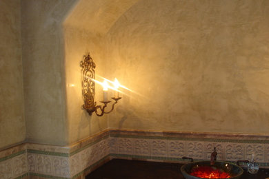 Tuscan powder room photo in San Diego