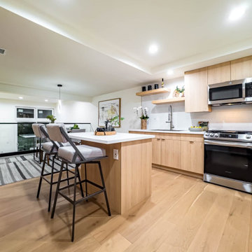 Light Oak Kitchen with Quartz Island and Stainless Range