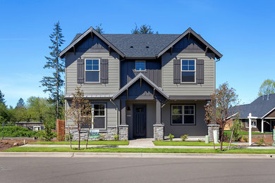 Mid-sized transitional gray two-story concrete fiberboard gable roof photo in Portland