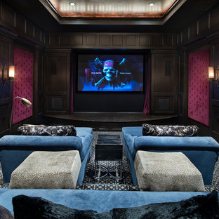 Medium sized mediterranean enclosed home cinema in Houston with red walls, carpet, a built-in media unit and blue floors.