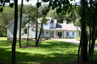 Example of a country exterior home design in Grand Rapids