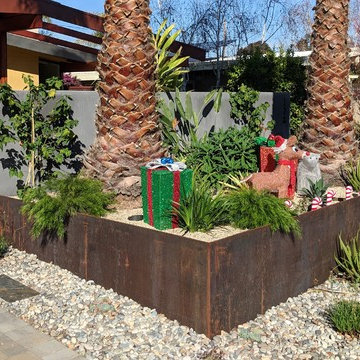 Secured Custom Steel Framed Gates with Slab Accent Garden Wall