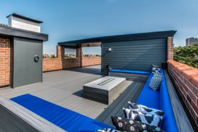 Inspiration for an expansive modern roof terrace in Chicago with a roof extension.