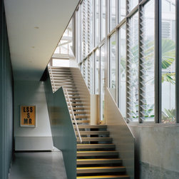 Elegant stairway inside the Redfern Warehouse using Breezway Louvres - Windows