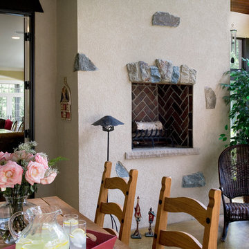 Stucco Fireplace with Dark Red Brick Herringbone Firebox