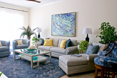 Inspiration for a mid-sized tropical open concept travertine floor and beige floor family room remodel in Tampa with multicolored walls, a ribbon fireplace, a stone fireplace and a wall-mounted tv