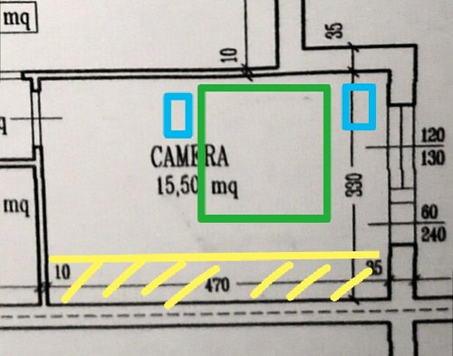 Arredare camera da letto stretta e lunga