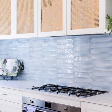 Costal kitchen with blue tile splashback