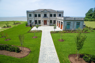 This is an example of a huge traditional full sun front yard stone driveway in Richmond.