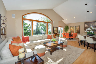 Large transitional enclosed light wood floor family room photo in Seattle with a bar, beige walls, no fireplace and a wall-mounted tv