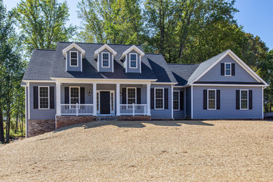 Inspiration for a transitional blue one-story vinyl exterior home remodel in DC Metro with a shingle roof