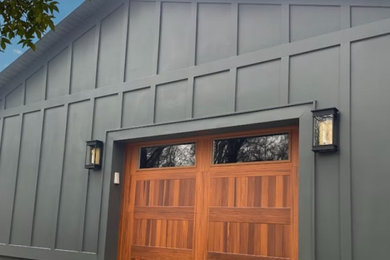 Large country four-car garage photo in Charlotte