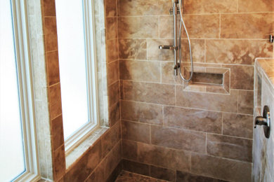 Huge elegant master ceramic tile bathroom photo in Kansas City with medium tone wood cabinets