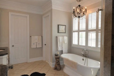 Inspiration for a large transitional master ceramic tile and beige floor bathroom remodel in Other with recessed-panel cabinets, white cabinets, beige walls, an undermount sink and granite countertops