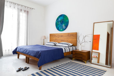 Example of a minimalist bedroom design in Other