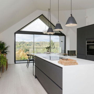 Open plan kitchen dining with feature gable glazing