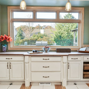 Kitchen Alcove with Painted Glazed Raised Paneled Doors and Wood Countertop
