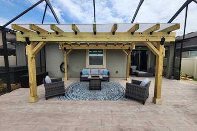 Small minimalist patio photo in Tampa with a pergola