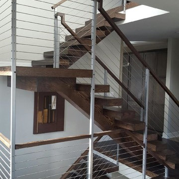 Open riser stairs with stainless steel cable wire railing