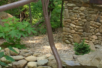 This is an example of a mid-sized rustic front porch design in Atlanta with decking and a roof extension.