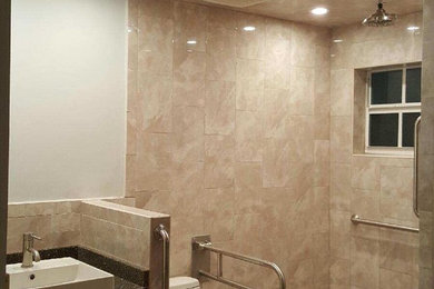 Example of a transitional master bathroom design in Miami
