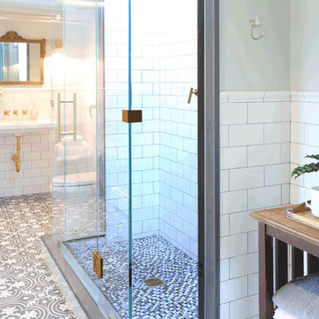 Basement bathroom with black and white floor tile, brass