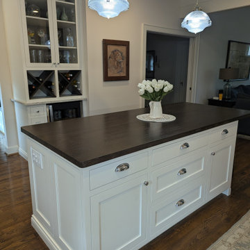 White inset cabinetry with walnut custom accents