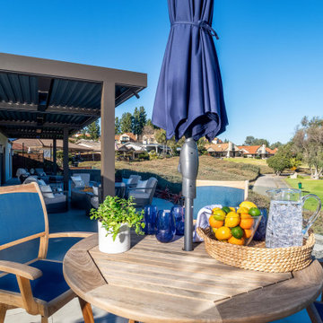 Modern Patio Dining Area with Golf Course Views and Covered Outdoor Lounge
