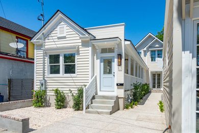 Example of a large transitional yellow two-story wood and clapboard duplex exterior design in Charleston
