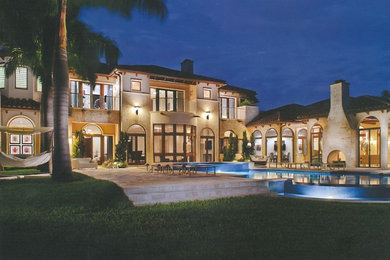 Inspiration for a large mediterranean home design remodel in Miami