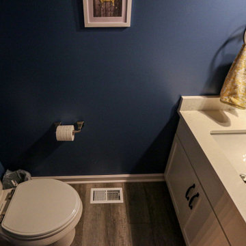 Blue Powder Room with White Vanity and Carrara Quartz Countertop