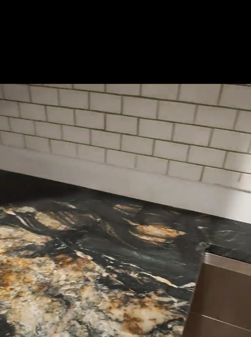 How to tile over existing backsplash and cover old countertop gap