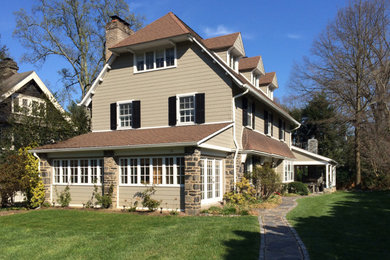 Inspiration for a mid-sized timeless beige three-story concrete fiberboard house exterior remodel in Philadelphia with a clipped gable roof and a shingle roof