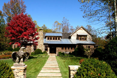 Example of a farmhouse exterior home design in Other