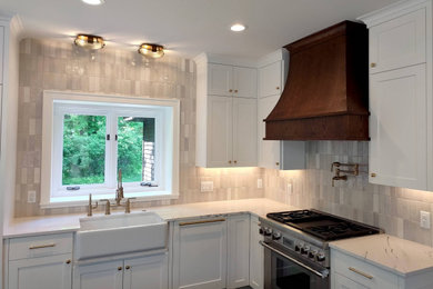 Inspiration for a mid-sized eat-in kitchen remodel in Minneapolis with white cabinets