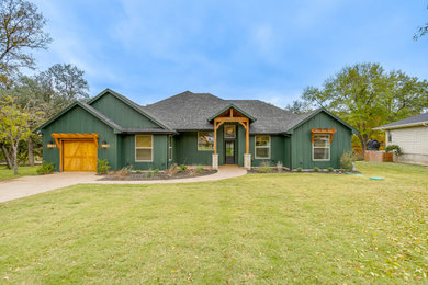 Inspiration for a craftsman green one-story house exterior remodel in Dallas with a shingle roof