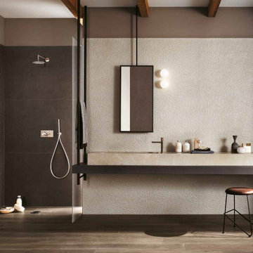 Modern bathroom with brown stone look porcelain tiled walls floors wash basin