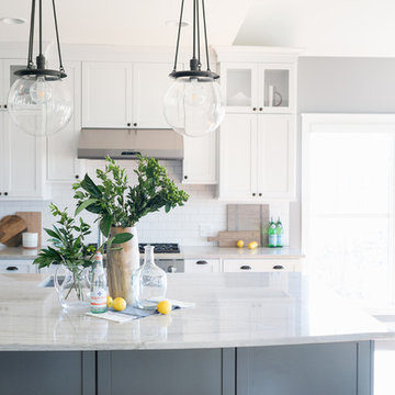Transitional White and Gray Kitchen with Big Bulb Pendants