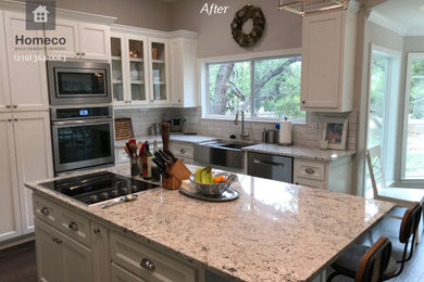 Eat-in kitchen - large modern galley dark wood floor eat-in kitchen idea with a farmhouse sink, shaker cabinets, white cabinets, quartzite countertops, white backsplash, ceramic backsplash, stainless steel appliances, an island and multicolored countertops