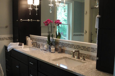 Inspiration for a transitional master bathroom remodel in New York with an undermount sink, shaker cabinets, dark wood cabinets and quartzite countertops