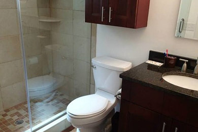 Mid-sized 3/4 ceramic tile alcove shower photo in Tampa with an undermount sink, shaker cabinets and dark wood cabinets