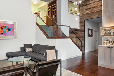 Inspiration for a large contemporary formal and open concept medium tone wood floor living room remodel in New York with white walls, a ribbon fireplace and a wall-mounted tv