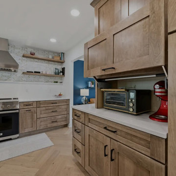 Warm Cherry Kitchen and Powder Room Remodel with Waterfall Island in Herndon, VA