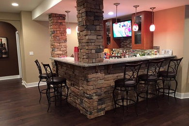 Example of a large transitional dark wood floor and brown floor home bar design in Denver