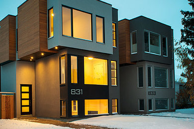 Minimalist blue two-story mixed siding exterior home photo in Calgary