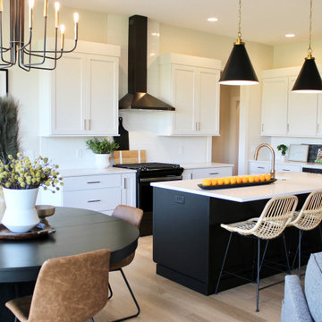 Great Room Kitchen with Black and White Cabinets in Bettendorf Iowa