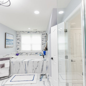Bathroom remodeling in Columbia, MD with double vanity & marble bathtub