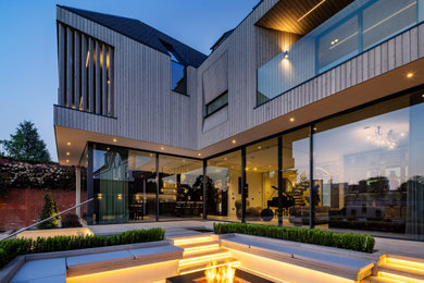 Inspiration for a large contemporary patio in Surrey.